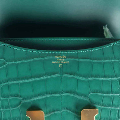 Handbag interior close-up with stitched lining and Hermès Paris made in France stamp