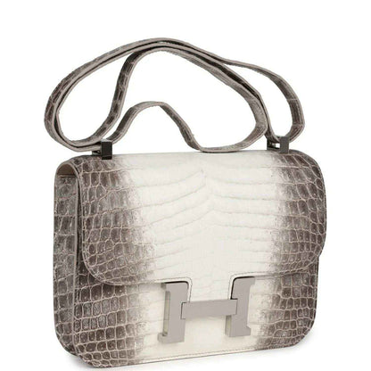 Constance-style handbag with croc texture, top handle, and palladium turn-lock front