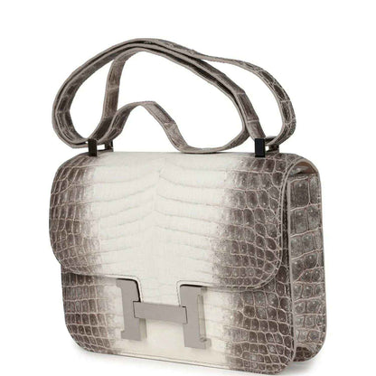 Constance-style bag angled view with croc-embossed finish and palladium front turn-lock