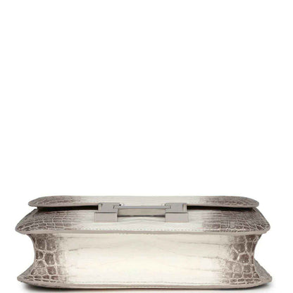 Constance-style handbag underside view with croc-embossed leather and palladium turn-lock plate