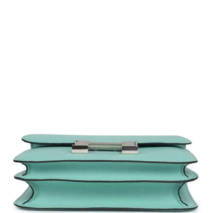 Aqua leather handbag top edge with turn-lock closure hardware