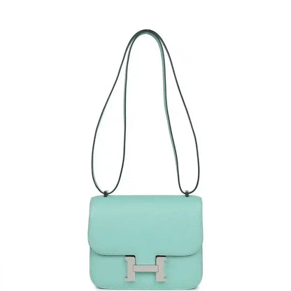 Aqua leather mini handbag with long shoulder strap and front flap