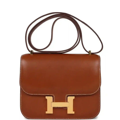 Brown leather Constance-style handbag with gold H clasp and top handle strap