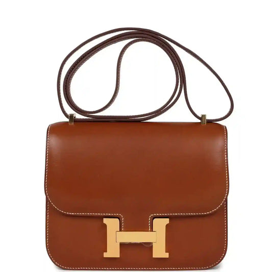 Brown leather Constance-style handbag with gold H clasp and top handle strap
