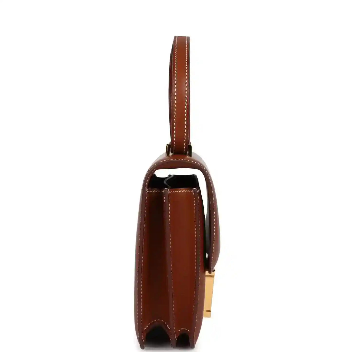Brown leather handbag side view with gold hardware and top handle strap