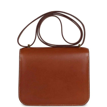 Brown leather Constance-style handbag with top handle straps and front flap