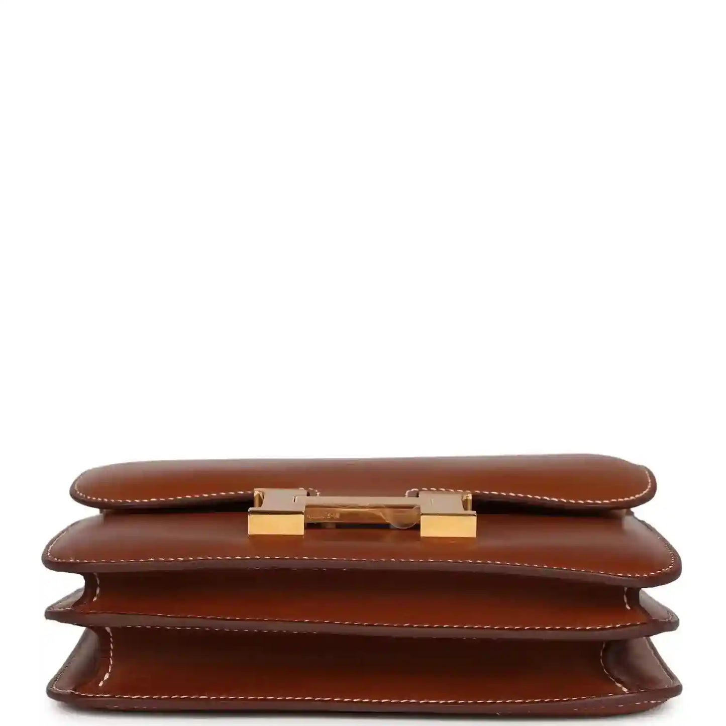 Brown leather handbag showing gold clasp hardware on the front flap
