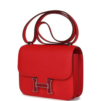 Red leather mini handbag with H clasp on front flap and side view