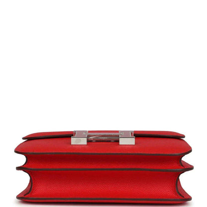 Red leather mini handbag top edge with metal H clasp and lining