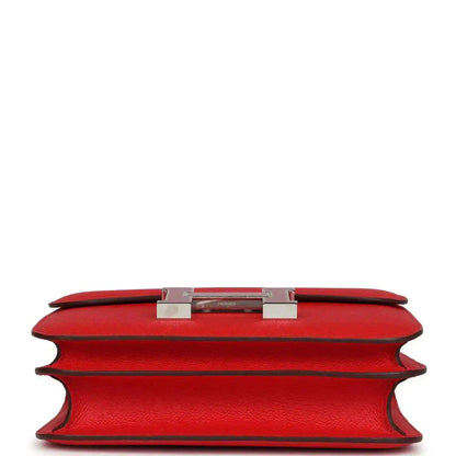 Red leather mini handbag top edge with metal H clasp and lining
