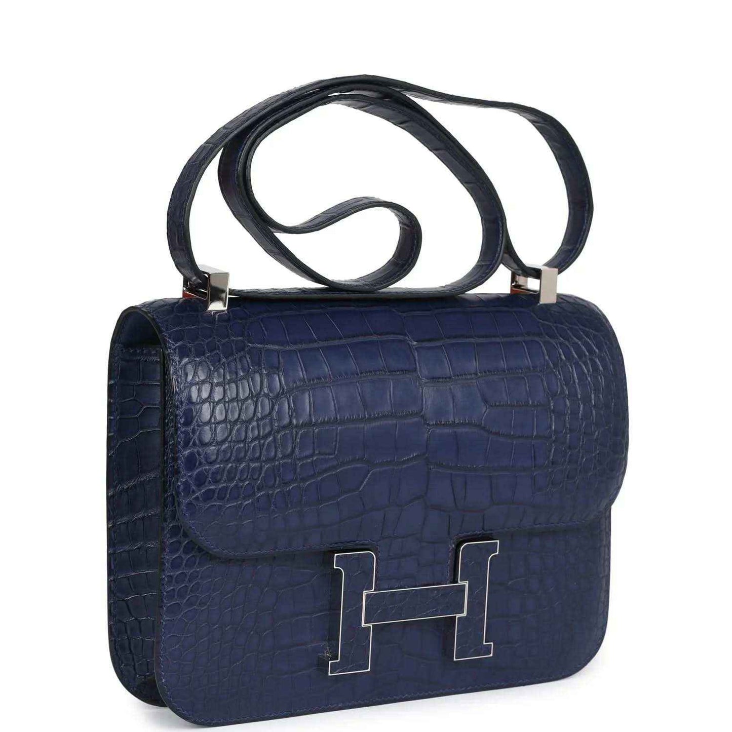 Blue alligator-effect handbag with shoulder strap, front flap, and palladium H clasp