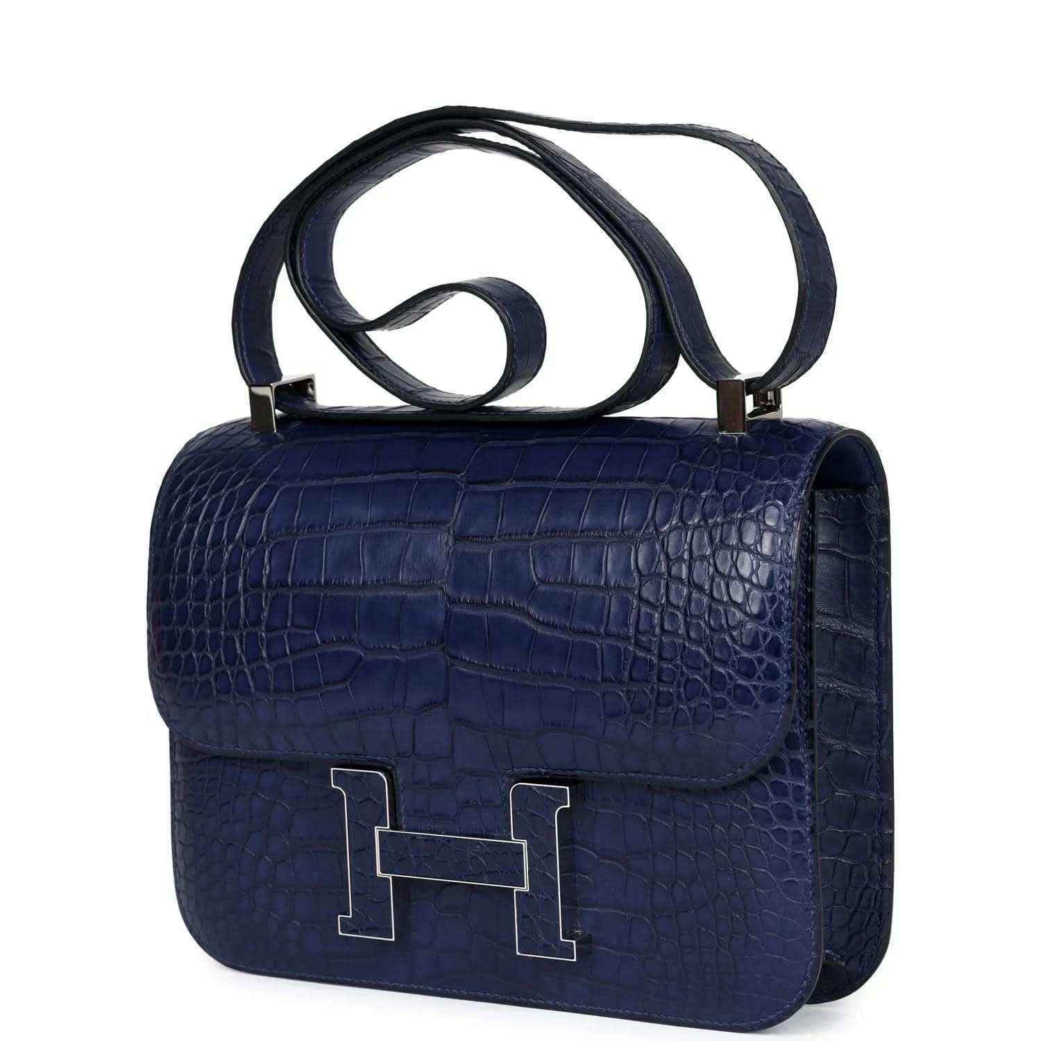 Blue alligator-effect handbag with top handle and front flap with H clasp