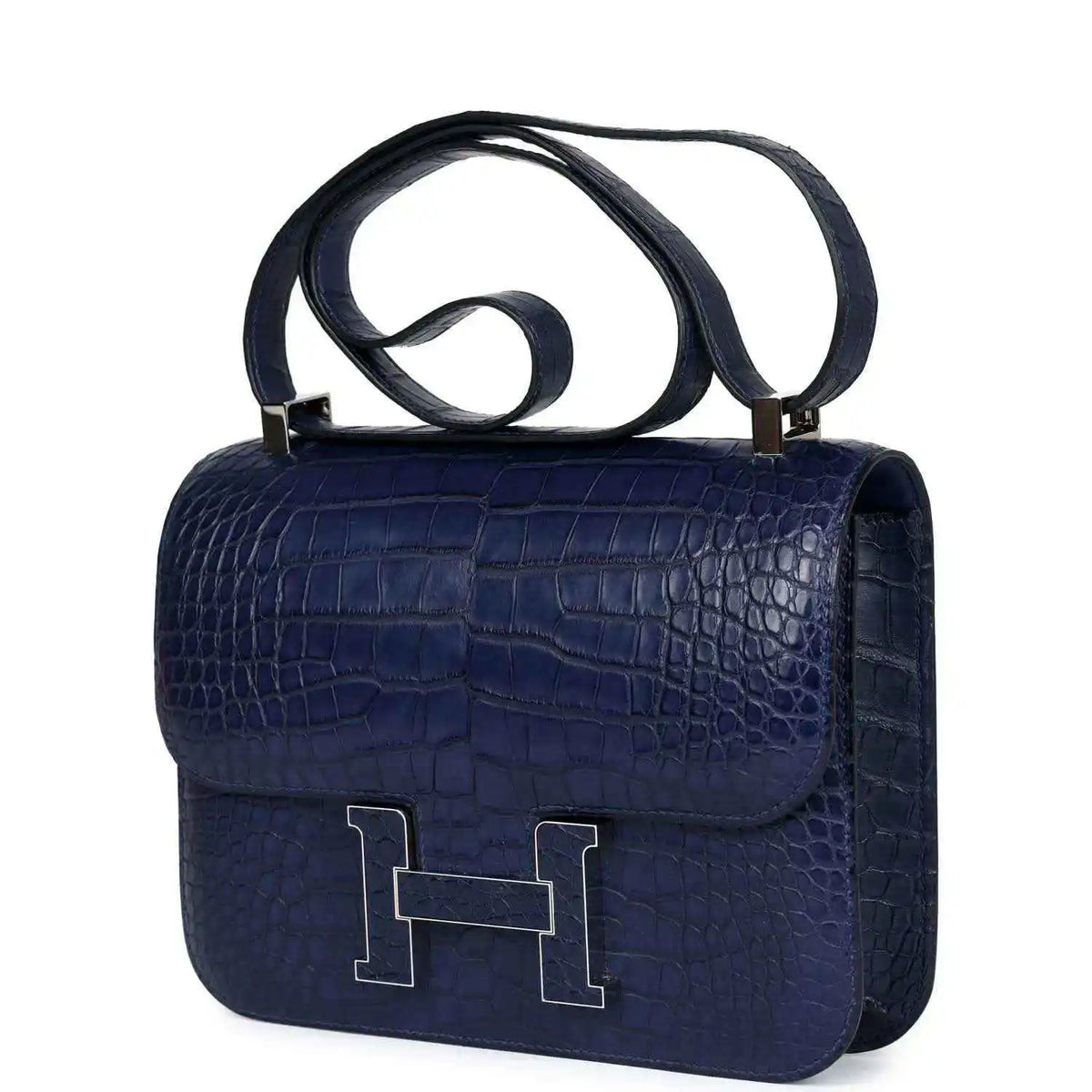 Blue alligator-effect handbag with top handle and front flap with H clasp