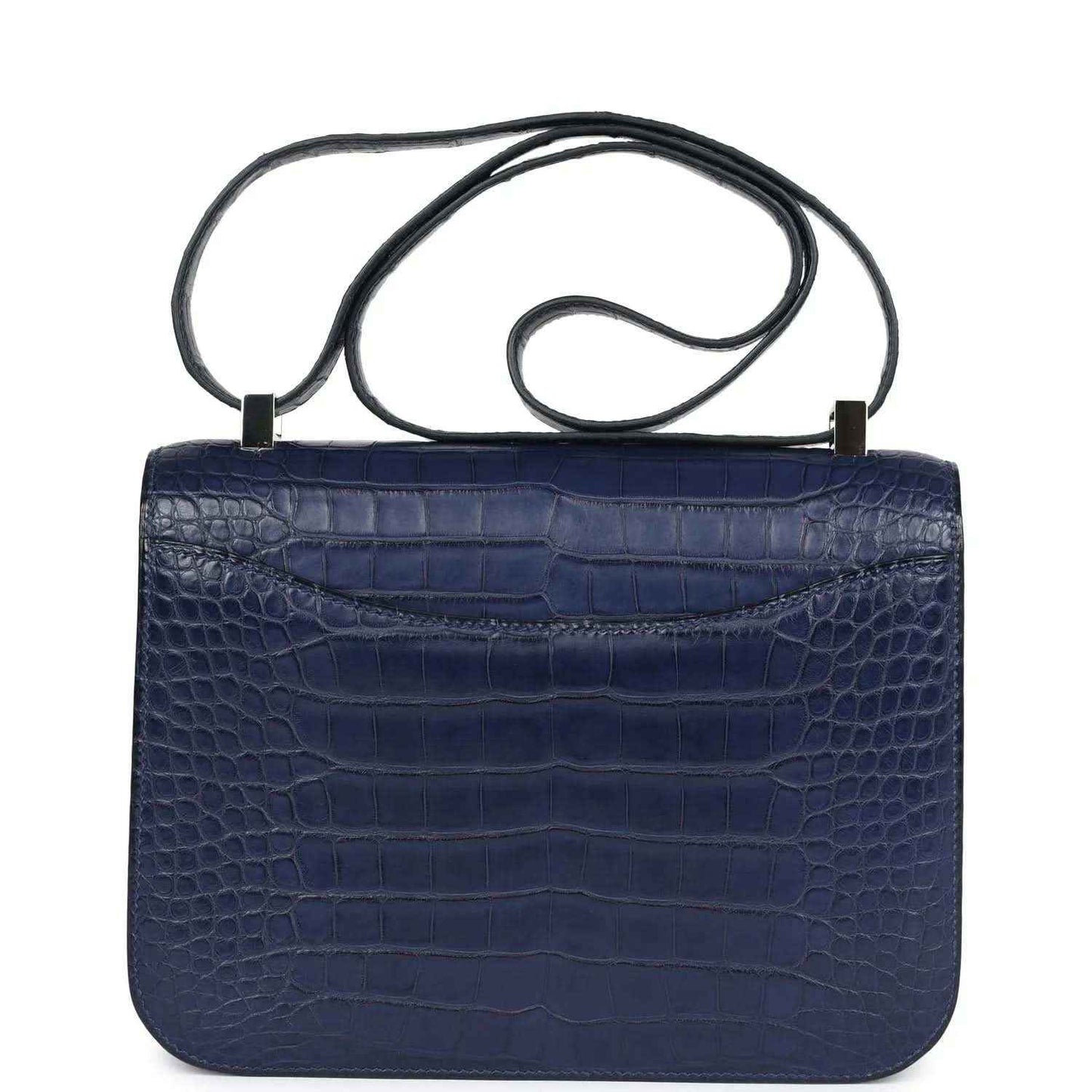 Blue alligator-effect handbag with top handle and plain flap back panel
