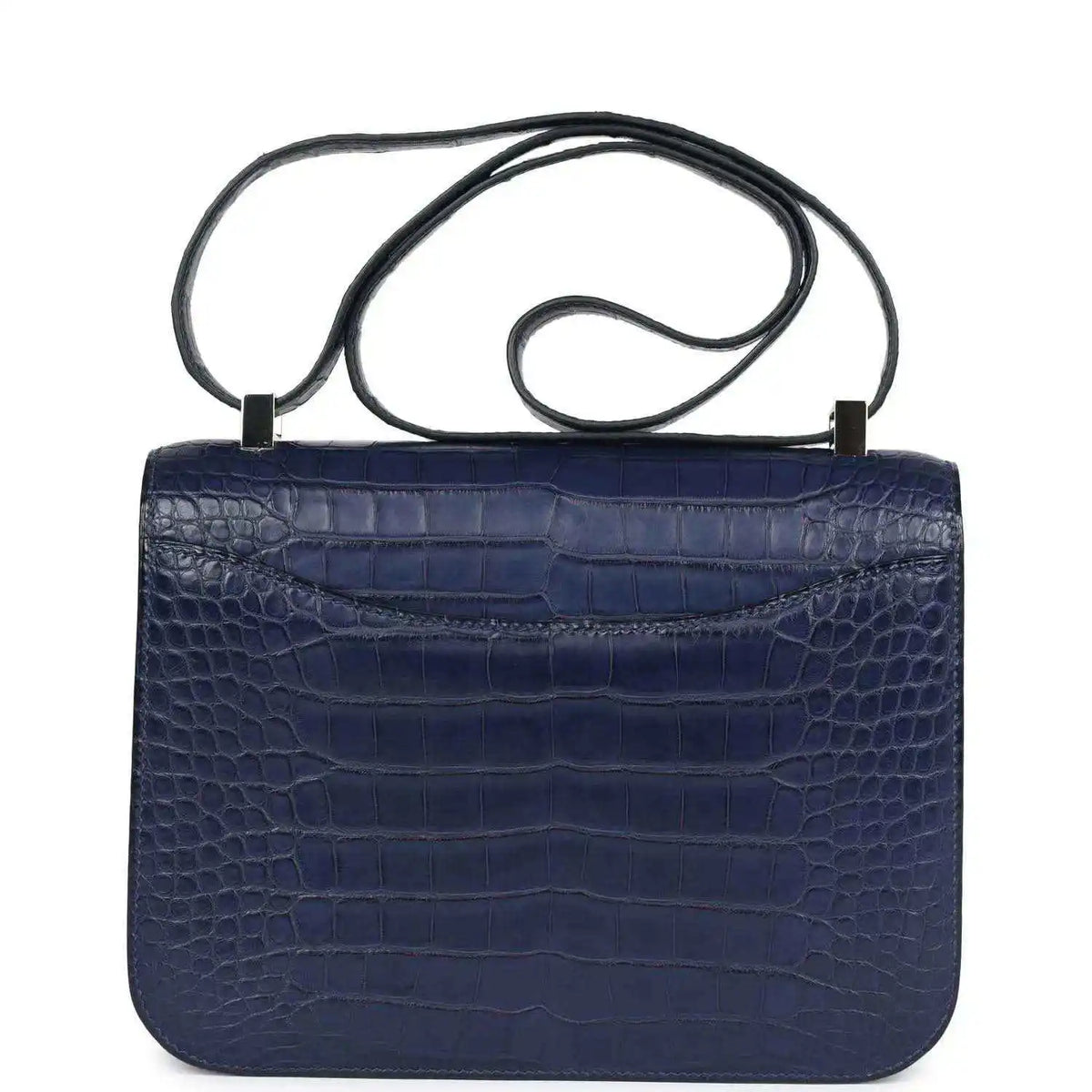 Blue alligator-effect handbag with top handle and plain flap back panel
