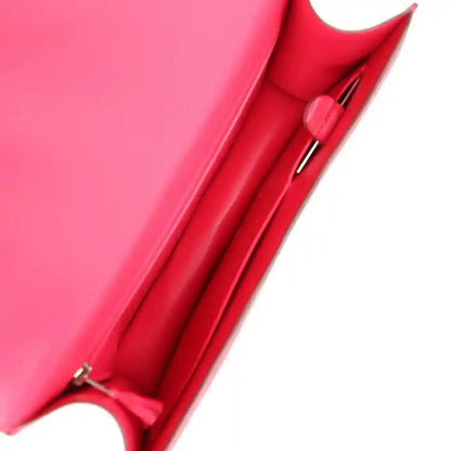 Constance bag interior compartment with red leather lining and stitched pocket