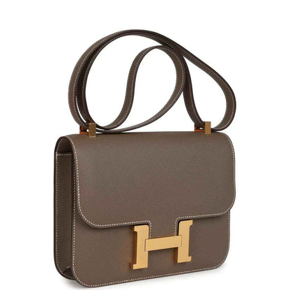 Taupe Epsom leather shoulder bag with flap, gold H clasp, and top handle straps