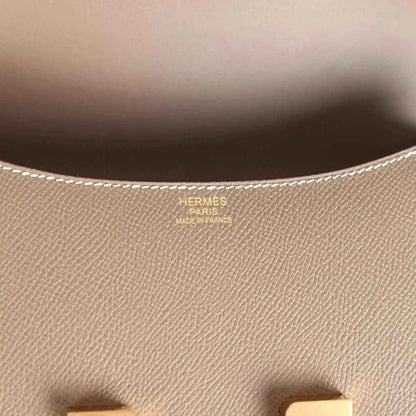 Leather interior close-up with Hermes Paris stamp and fine textured grain
