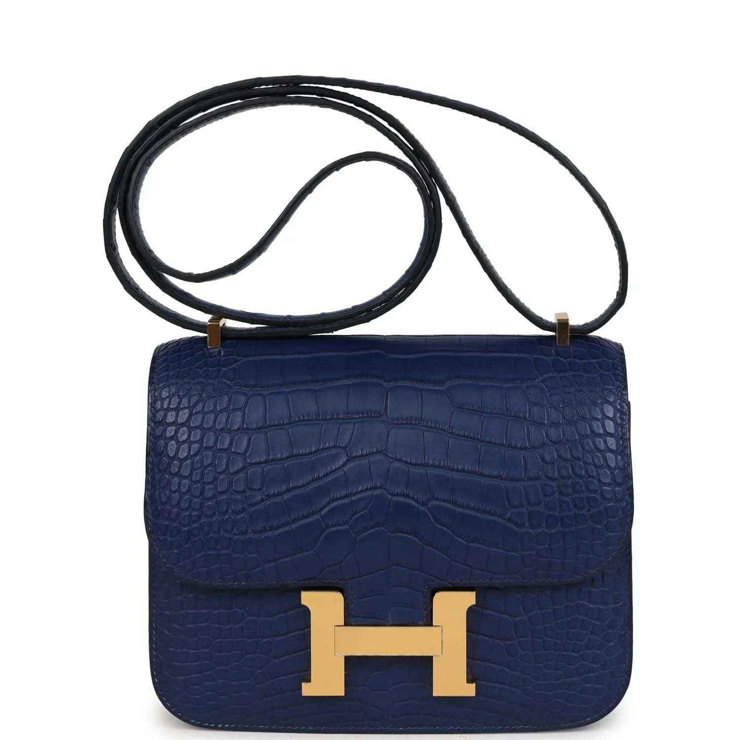 Blue alligator-style crossbody bag with gold H clasp and leather strap