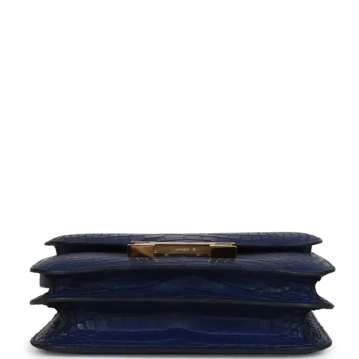 Blue alligator-style bag bottom with gold top hardware and layered folds