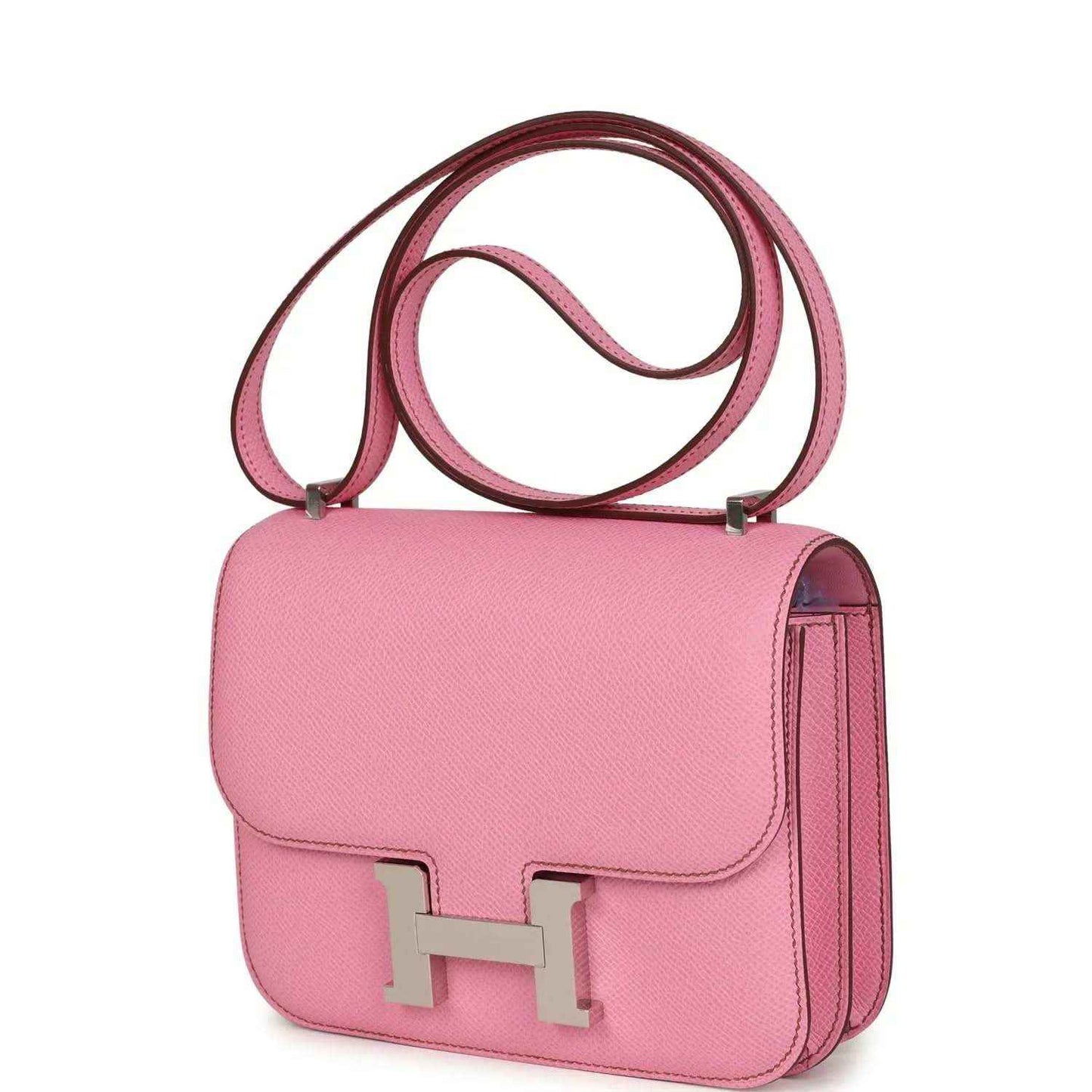 Pink leather handbag with flap, H clasp, and vertical side pocket