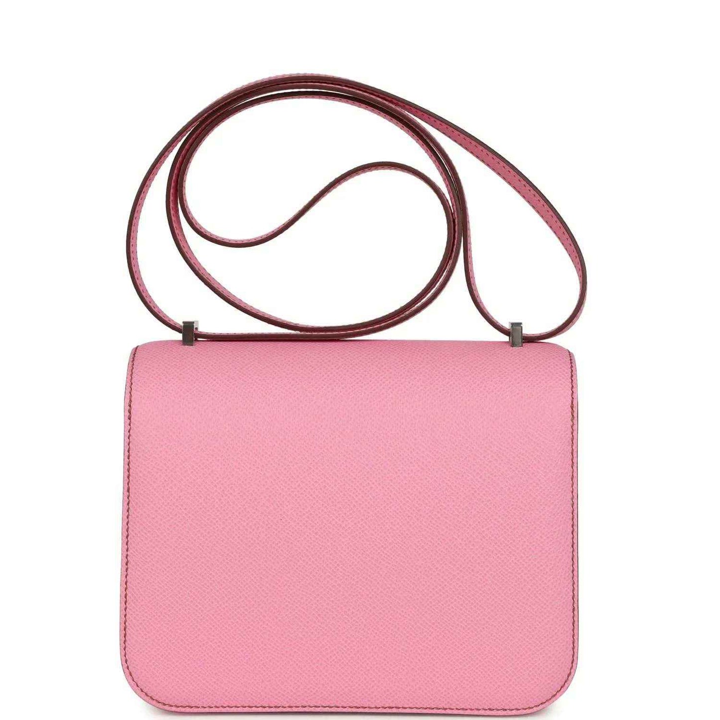 Pink leather rectangular crossbody bag with flap and top shoulder strap