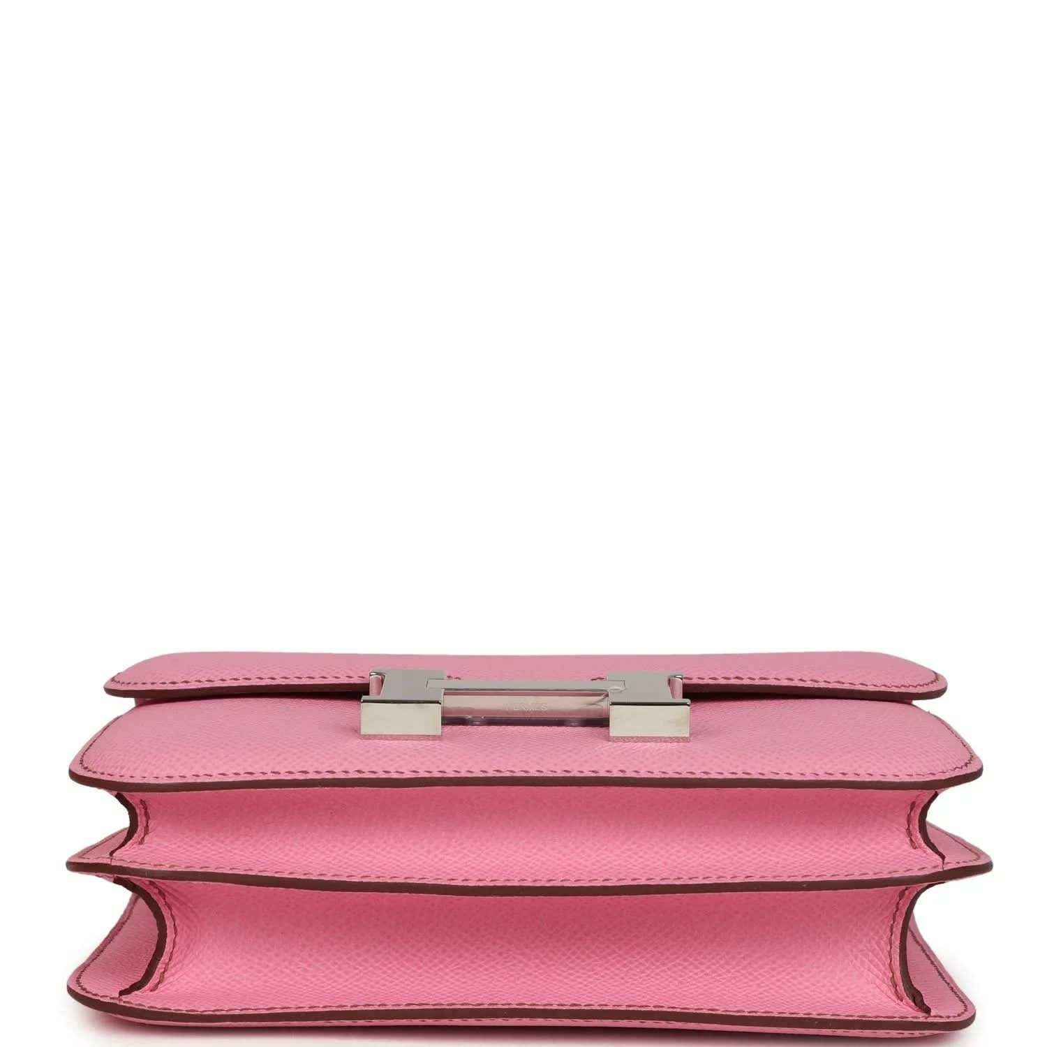 Pink leather bag underside view with H clasp hardware and open edge