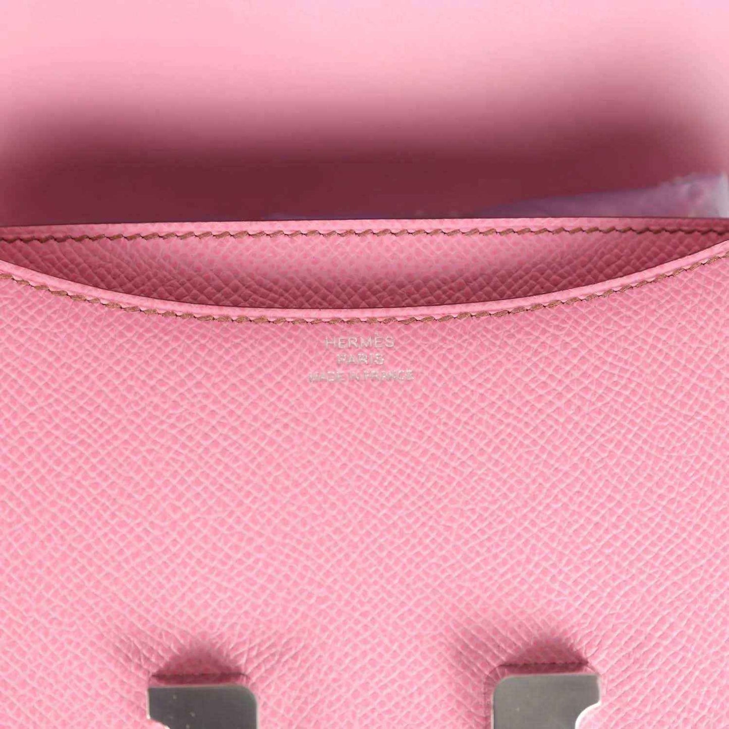 Pink Epsom leather flap lining close-up with stitching and Hermes logo
