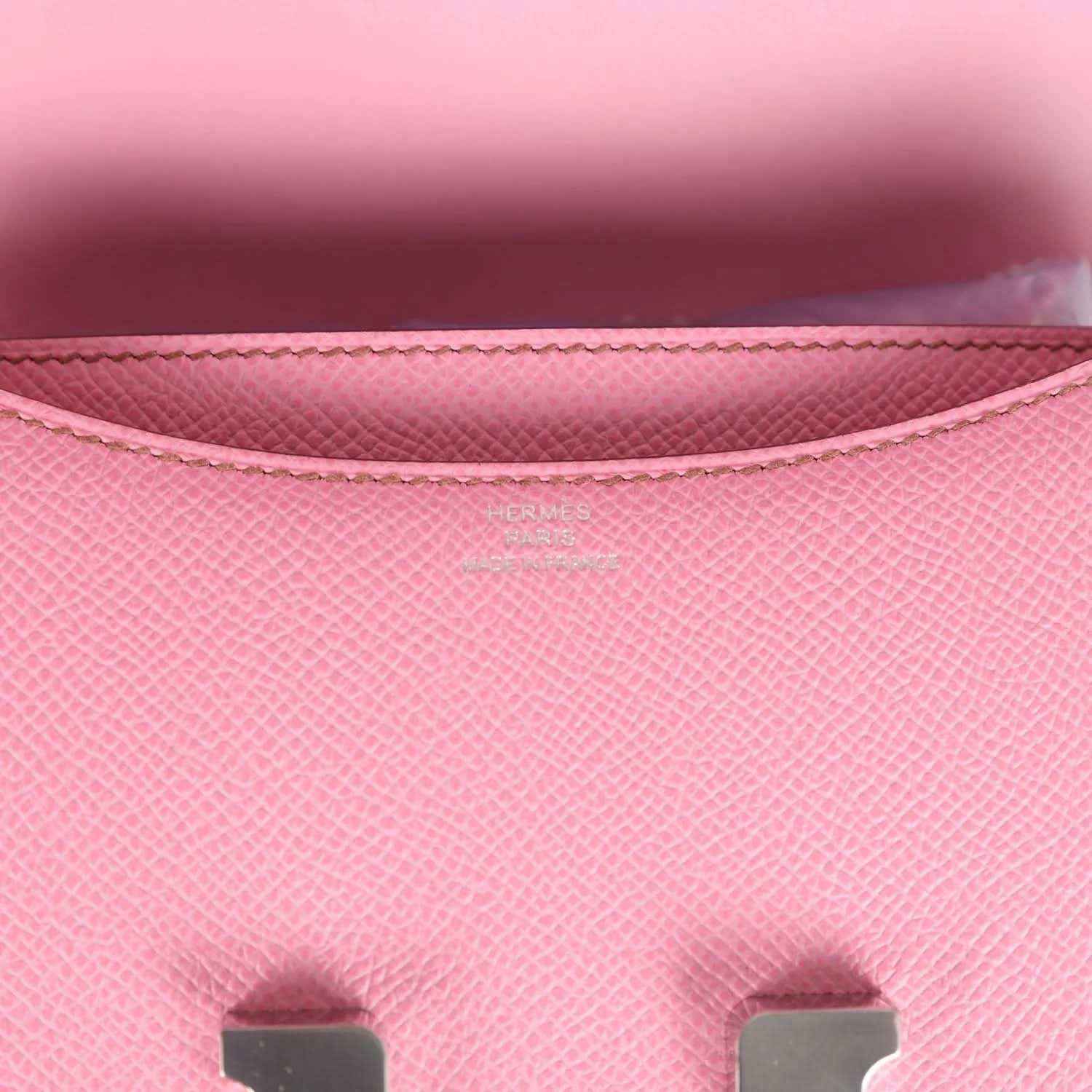 Pink Epsom leather flap lining close-up with stitching and Hermes logo
