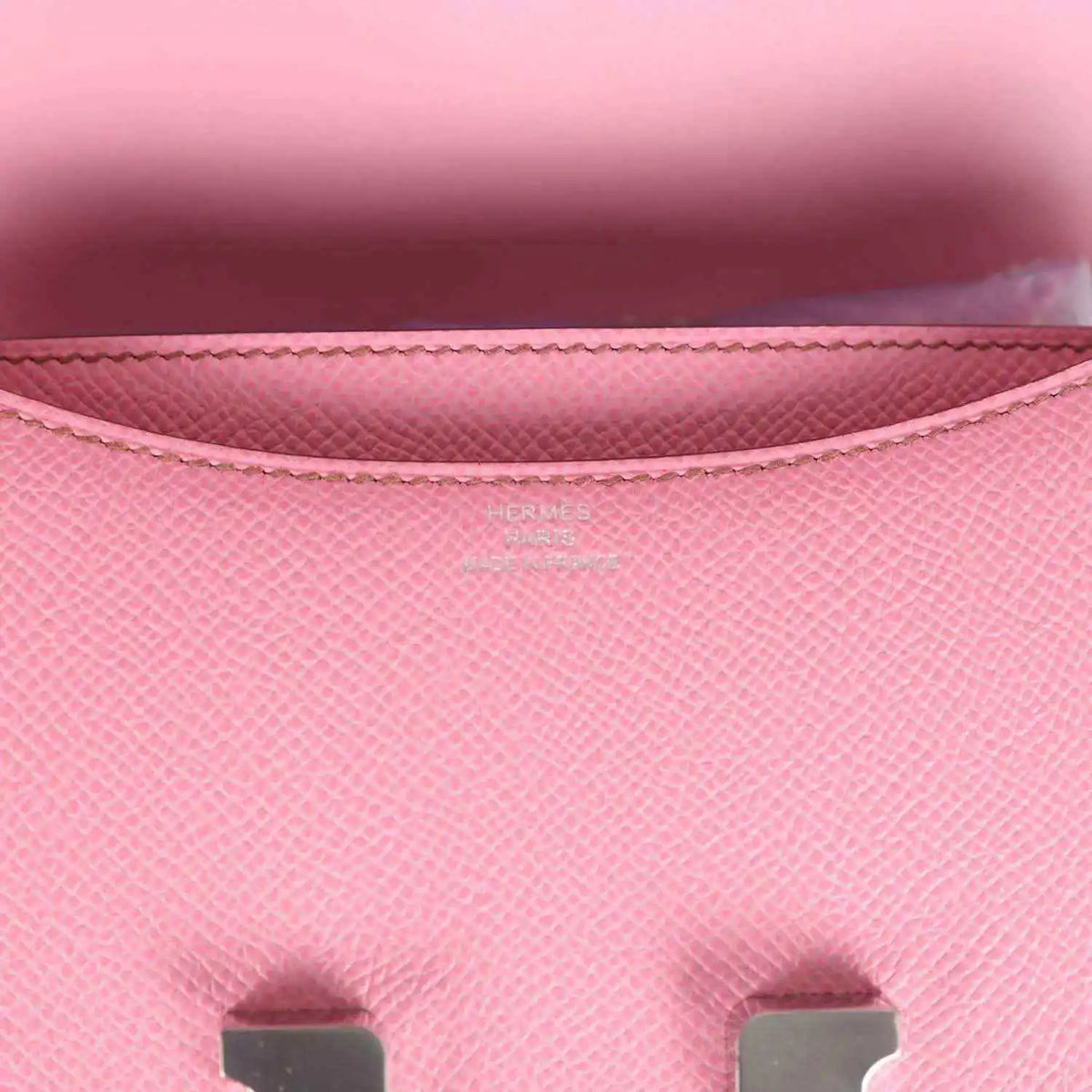 Pink Epsom leather flap lining close-up with stitching and Hermes logo