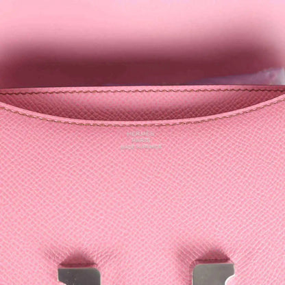Pink Epsom leather flap lining close-up with stitching and Hermes logo