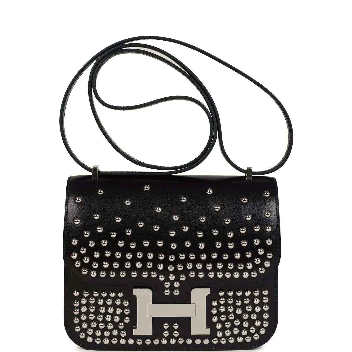 Black studded leather shoulder bag with long strap and metal H clasp