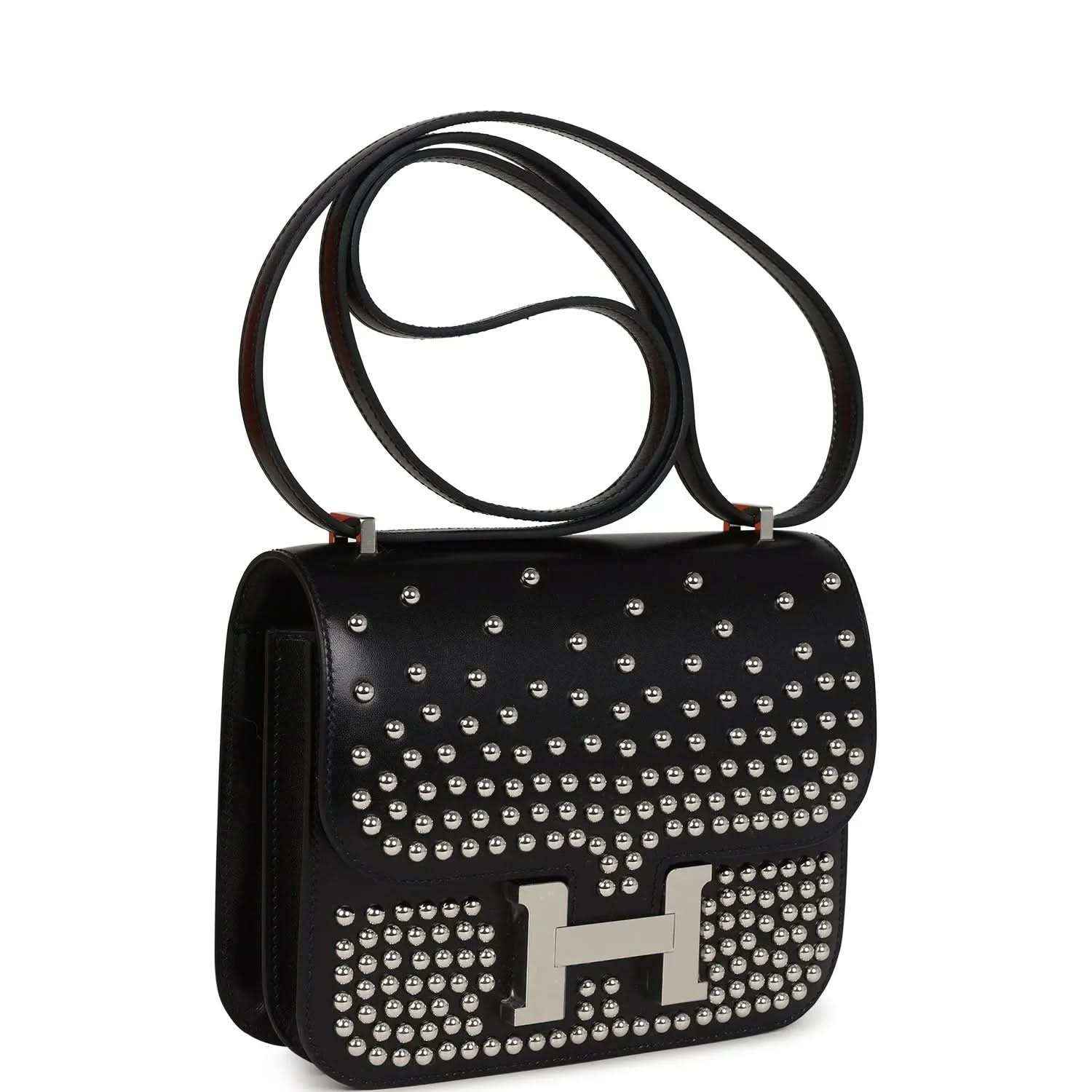 Black studded leather handbag with top handle, metal H clasp detail