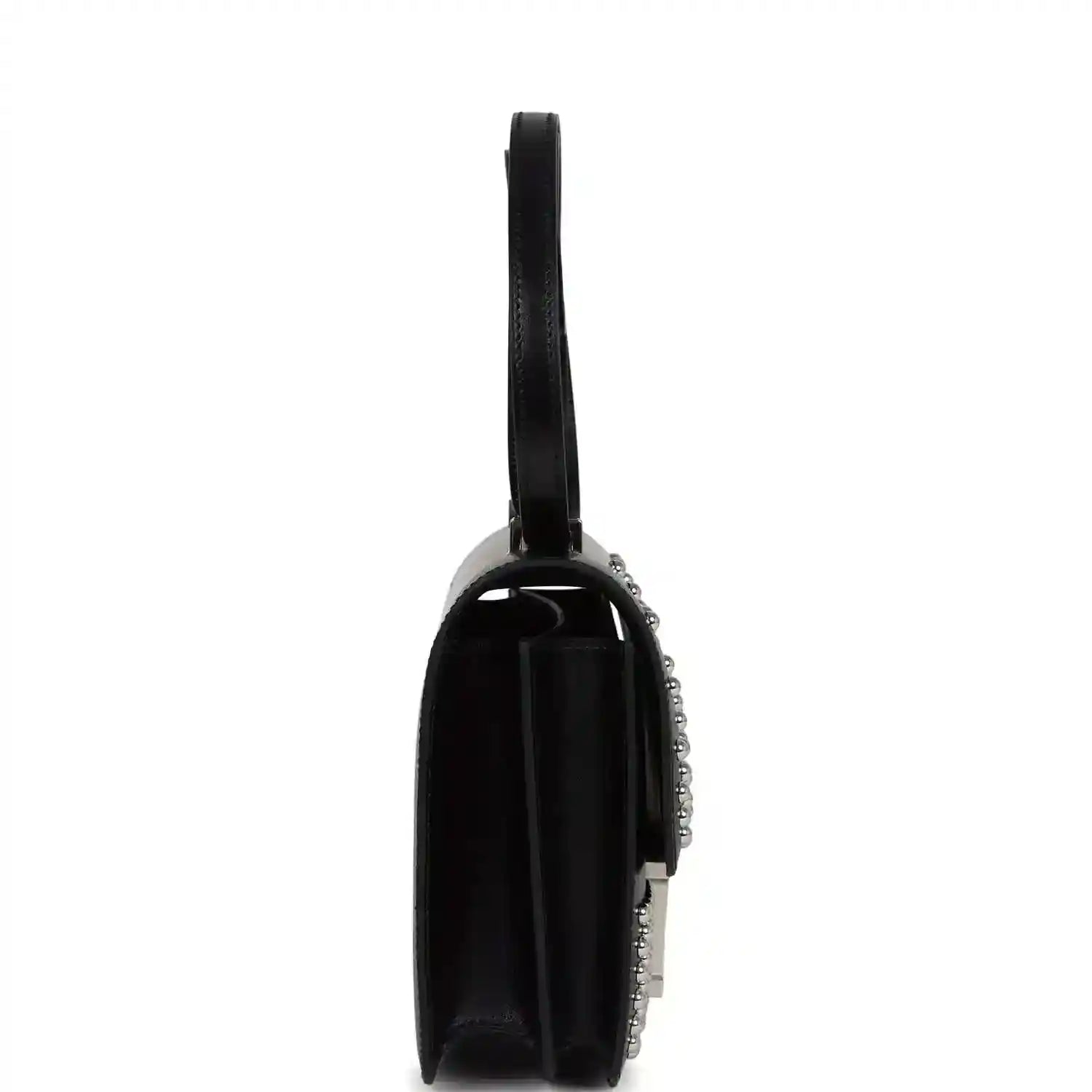 Black leather flap bag from side view with studded trim and top handle