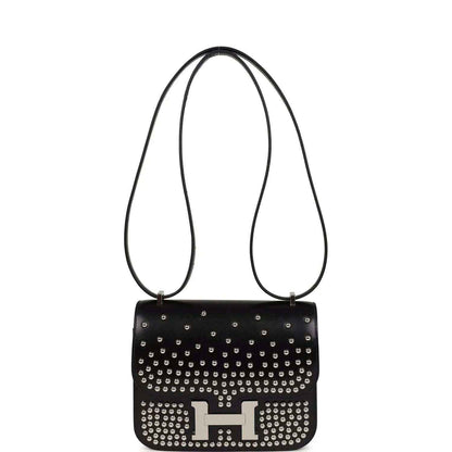 Black studded leather handbag with long shoulder straps and metal H clasp