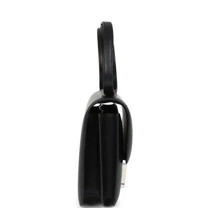 Hermes Constance 18 bag, black leather end view with strap and Palladium H hardware