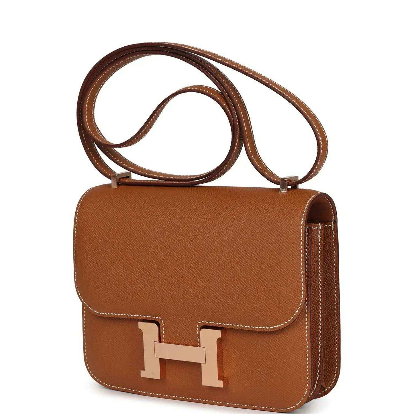 Brown leather mini handbag with top handle, side stitching, and front H clasp
