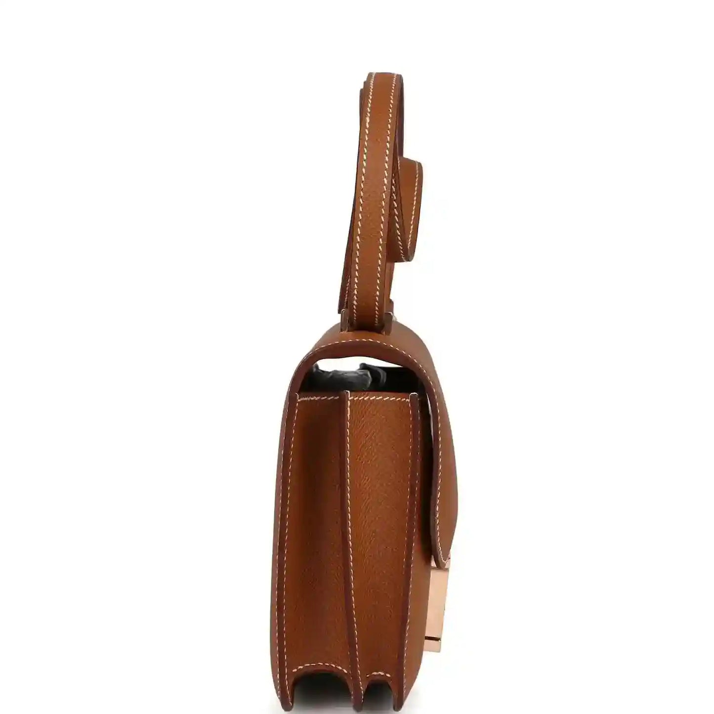 Brown leather mini handbag side view with top handle strap and flap edge