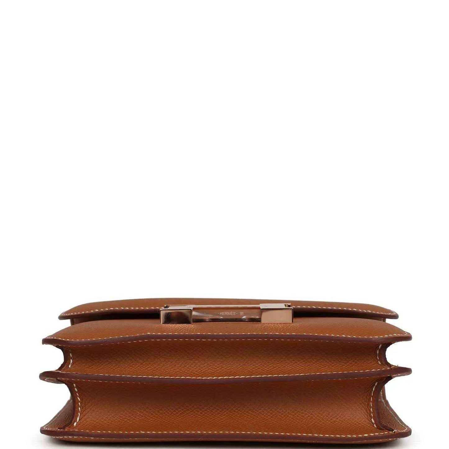 Brown leather mini handbag interior view showing side gusset and inner lining