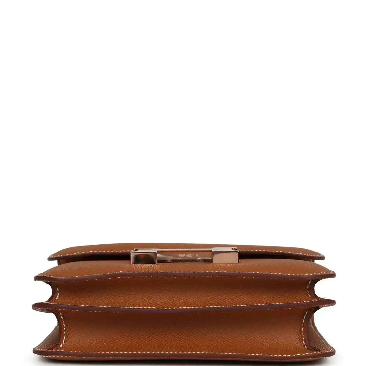 Brown leather mini handbag interior view showing side gusset and inner lining