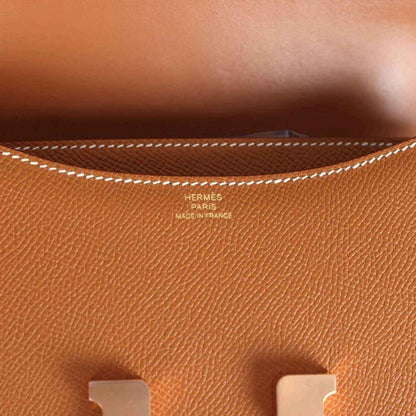 Brown Epsom leather close-up with Hermes Paris stamp and maker text