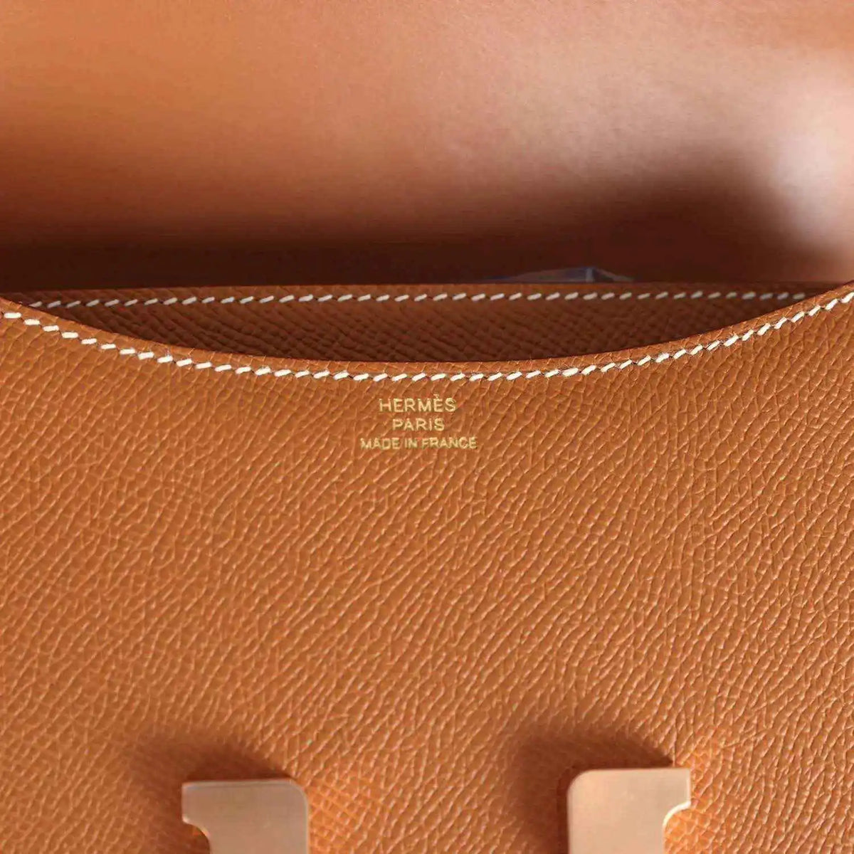 Brown Epsom leather close-up with Hermes Paris stamp and maker text