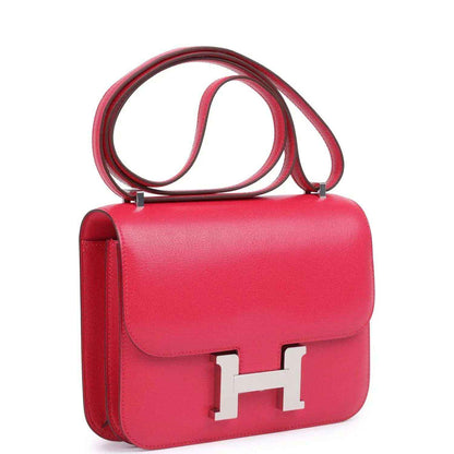 Hermes Constance 18 bag in rose pink leather with side view, front flap, and H clasp