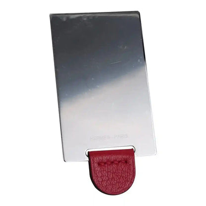 Hermes branded protective cover with red leather clip and silver-toned card