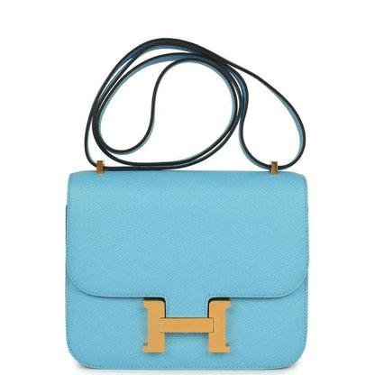 Mini crossbody bag in light blue leather with gold H clasp and top flap