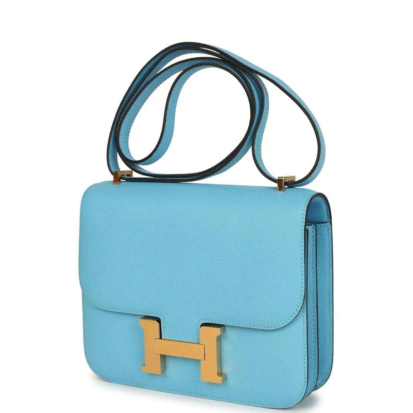 Mini crossbody bag in light blue leather with gold H clasp and side profile