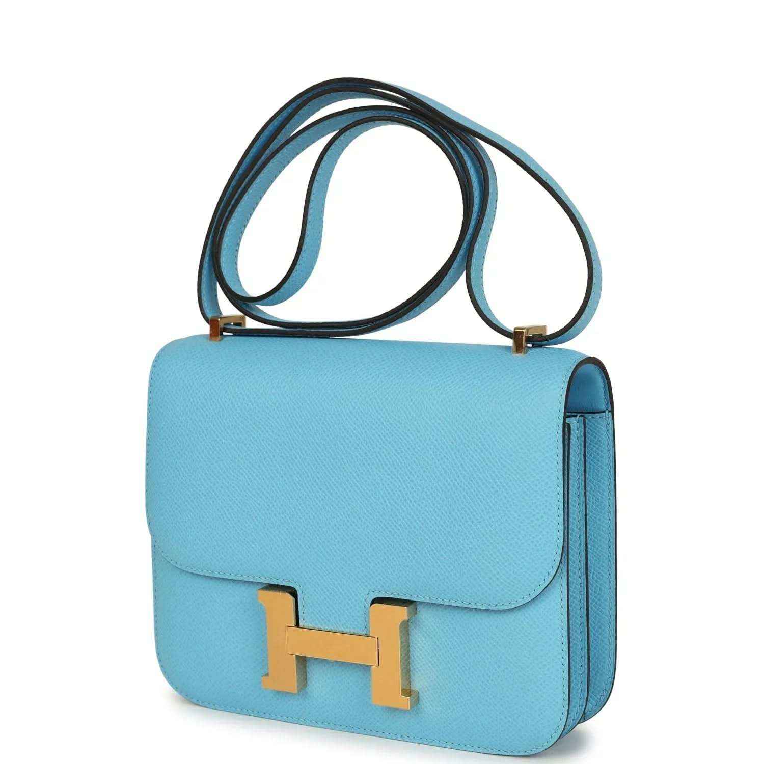 Mini crossbody bag in light blue leather with gold H clasp and side profile