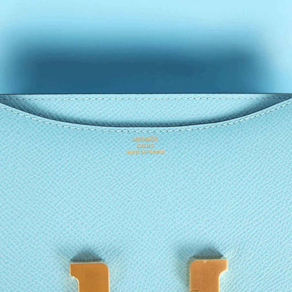 Light blue leather mini bag interior lining with embossed stamp near top