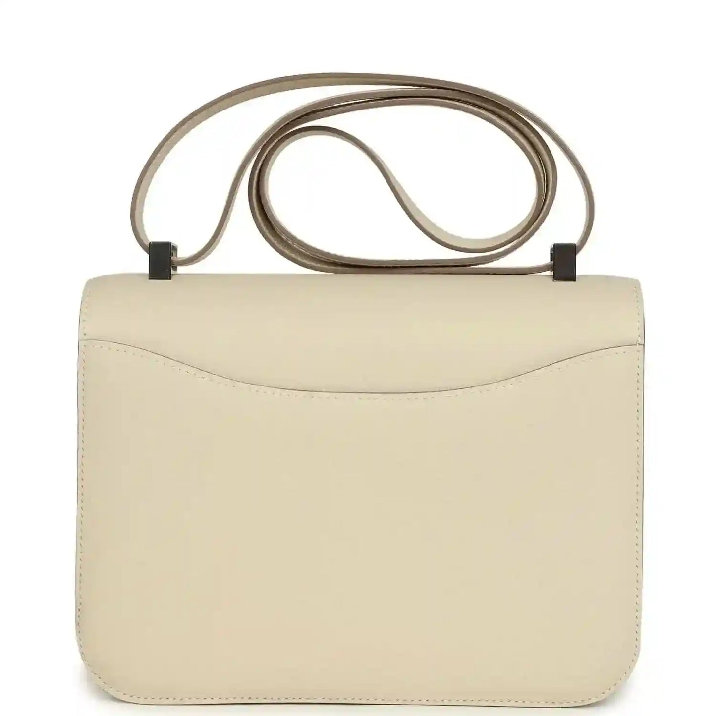 Beige leather handbag front view with curved flap and light silver clasp, top handle