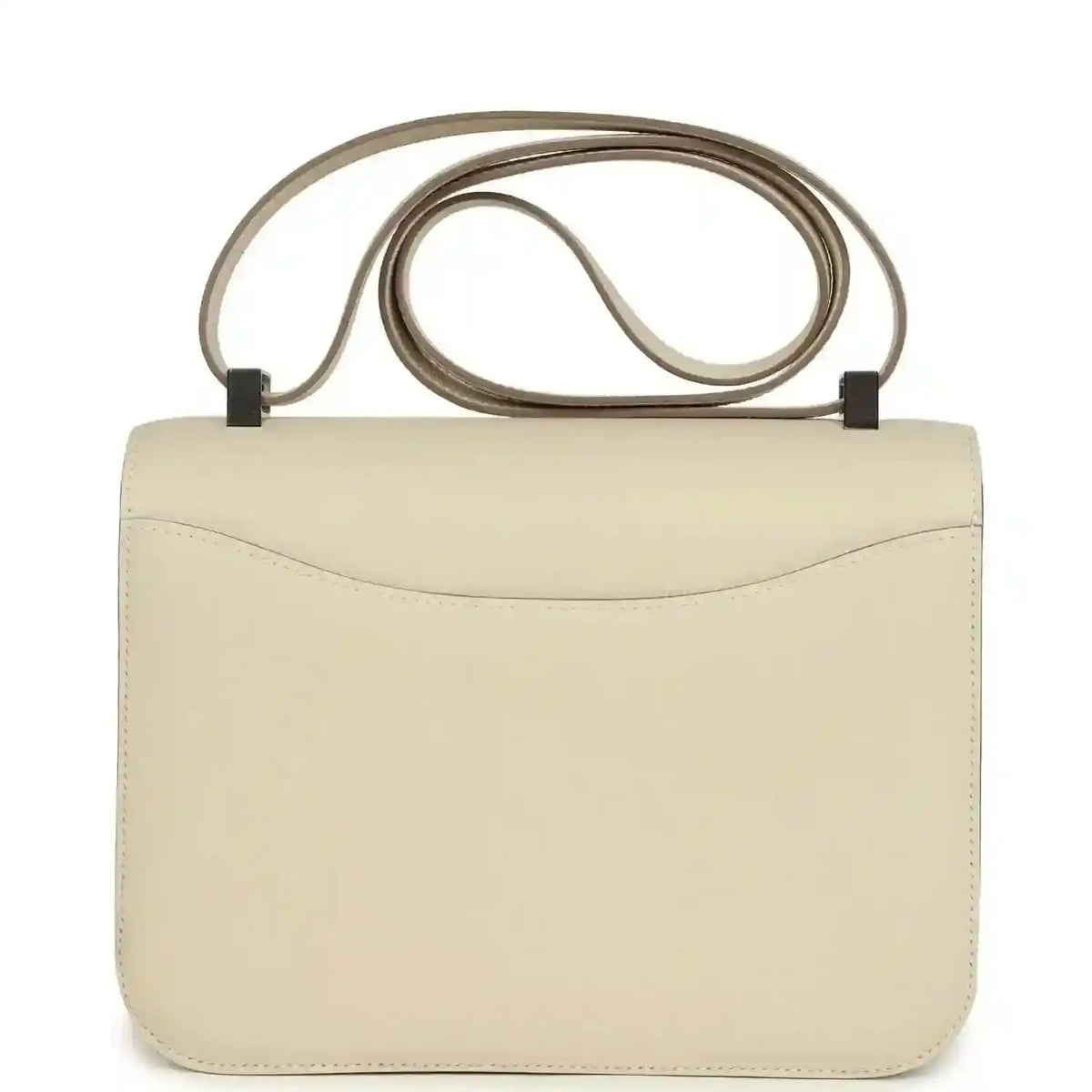 Beige leather handbag front view with curved flap and light silver clasp, top handle